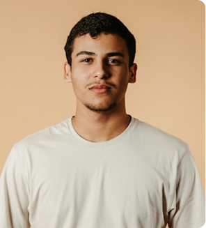 Daniel Joseph wearing a light beige t-shirt.